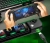 Kontroler mobilny GameSir X2 Pro czarny w dłoniach przy podświetlanej klawiaturze, gra na telefonie