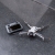 Zestaw filtrów VND Freewell Mist do DJI Mini 4 Pro – dron z filtrem i aparatura na asfalcie