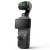 DJI Osmo Pocket 4 ukośnie z lewej, ekran obrócony do poziomu i wygaszony