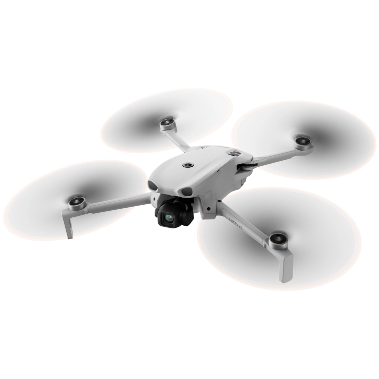 DJI Lito X1 w zawisie z wirującymi śmigłami, widok z ukosa