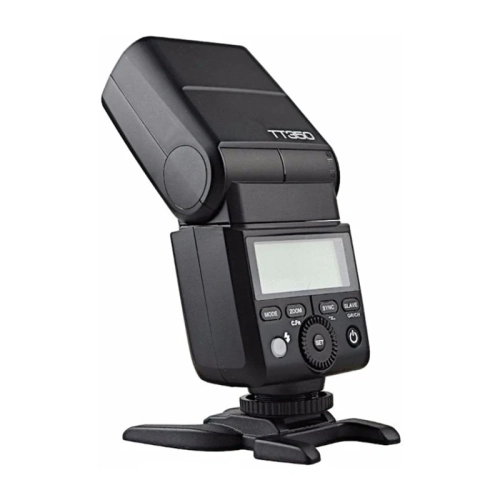 Godox TT350C do Canon z odchyloną głowicą błyskową na podstawce, widok z boku