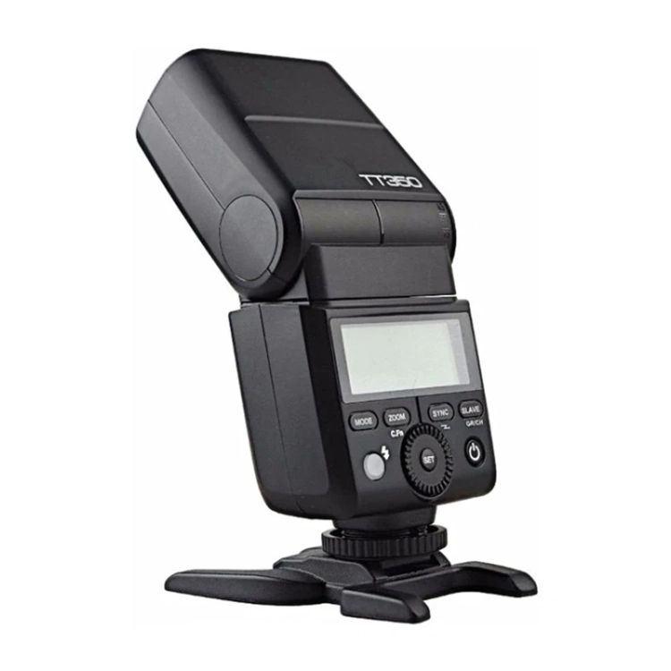 Godox TT350C do Canon z odchyloną głowicą błyskową na podstawce, widok z boku