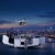 Dron DJI Matrice 5TD startujący nocą z otwartej stacji DJI Dock 4 na dachu