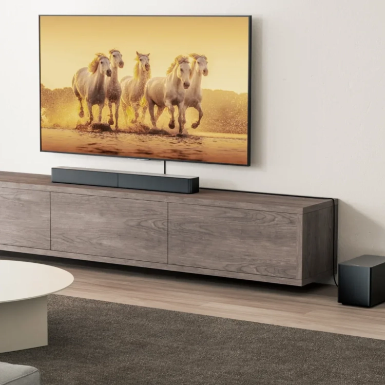Ultimea Poseidon M60 Boom na szafce pod telewizorem, subwoofer obok na podłodze