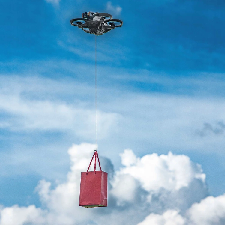 System zrzutu STARTRC do DJI Avata 2 dron z zawieszonym ładunkiem w locie
